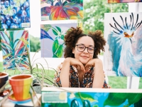 woman hosting an art expo fundraiser